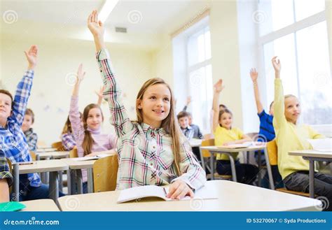 Elementary Students Raising Their Hands