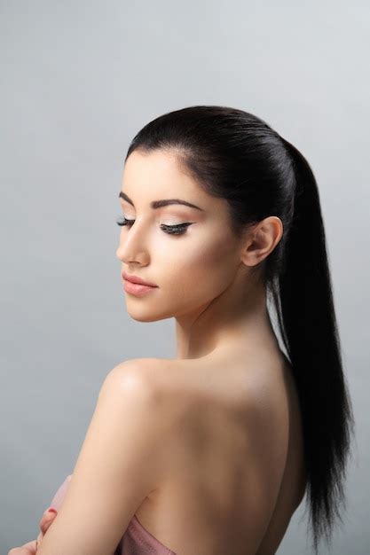 Free Photo Woman With Ponytail Hairstyle And Nude Makeup