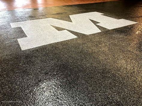 Polished concrete flooring is the top choice for a mancave, due to its practicality in both function and if you live in peoria and are thinking of renovating your basement (or other room in your house) to. Epoxy Flake Floor with Logo in University- Zion Pros ...