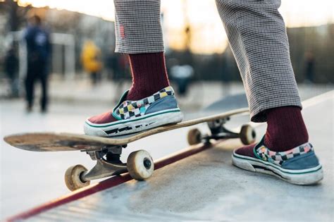 Premium Photo Skateboarder In Sneakers Riding On Board In Outdoor Park