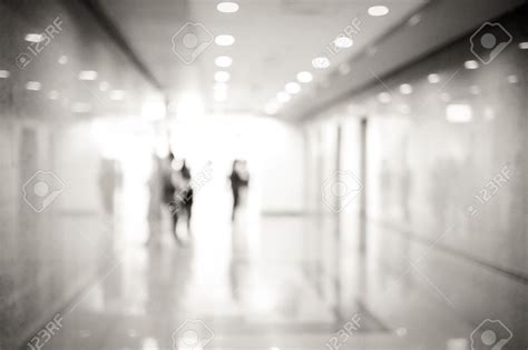 Blur Inside Office Building With People And Bokeh Light Background