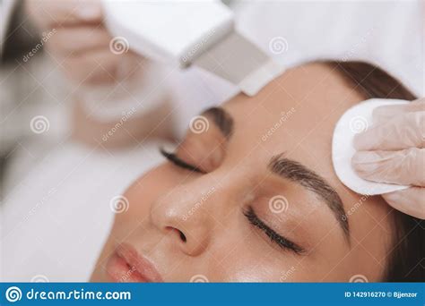 Lovely Young Woman Visiting Cosmetologist At Beauty Clinic Stock Photo