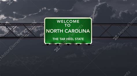 4k Passing North Carolina Usa State Border Welcome Road Sign At Night