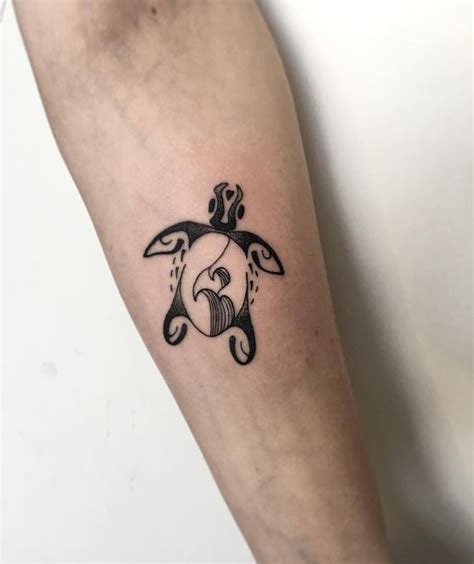 A Small Turtle Tattoo On The Arm