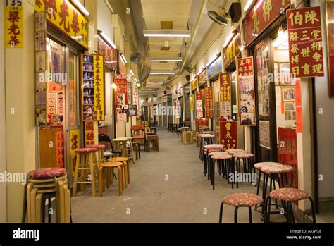 Long Hallway With Many Storefronts In Hong Kong Stock Photo Alamy
