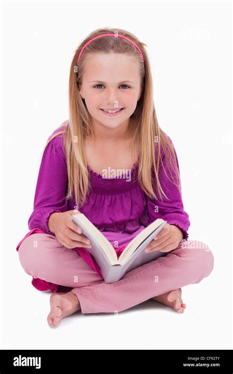 Portrait Of A Happy Girl Reading A Book Stock Photo Alamy