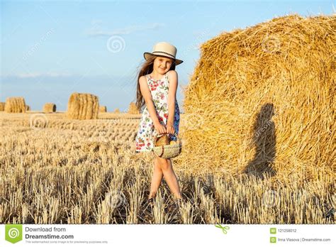 Happy Girl On Field Of Wheat With Bread Stock Photo