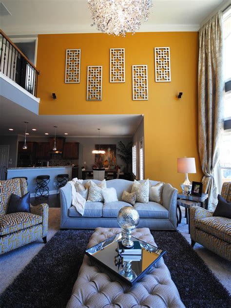 See more ideas about yellow walls, yellow living room, room colors. Yellow & Gray Contemporary Living Room | Paisley McDonald | HGTV