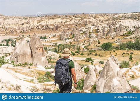 A Traveller With Backpack Looking To Cappadocia Landscape Goreme Town
