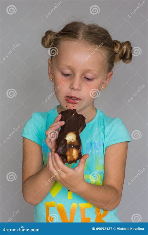 The Girl With Two Plaits Biting A Chocolate Cake Stock Image Image Of