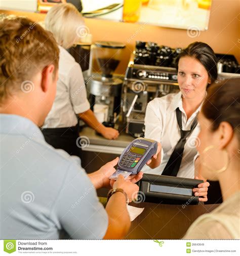 Want to pay your bill online? Man Paying With Credit Card At Cafe Royalty Free Stock Images - Image: 26643649