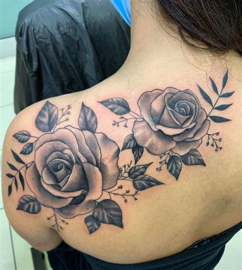 rose vine tattoos on thigh