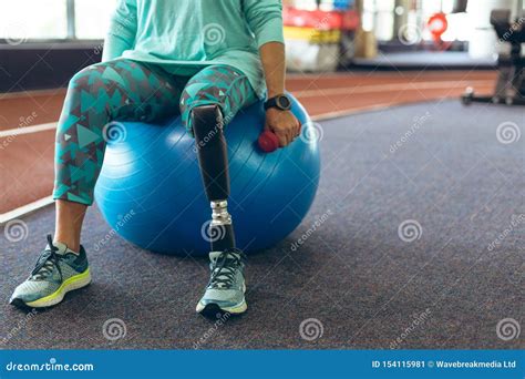 Amputee Being Taken For A Walk In A Wheelchair Royalty Free Stock Image