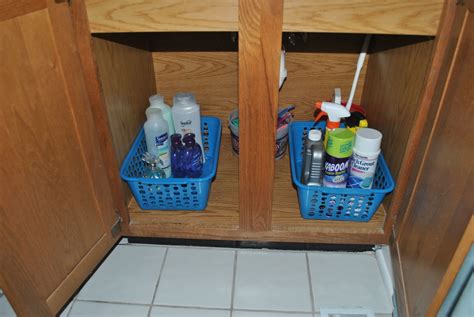 Two Blue Baskets Filled With Personal Care Items Sit In The Corner Of A