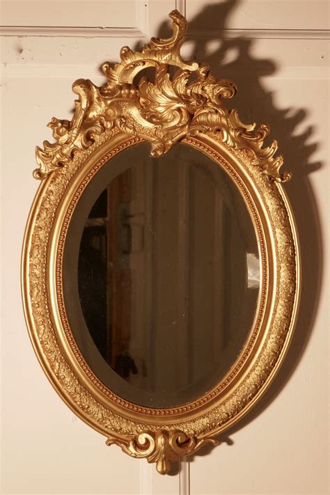 A Dainty French Rococo Oval Gilt Wall Mirror | 566399 | Sellingantiques.co.uk