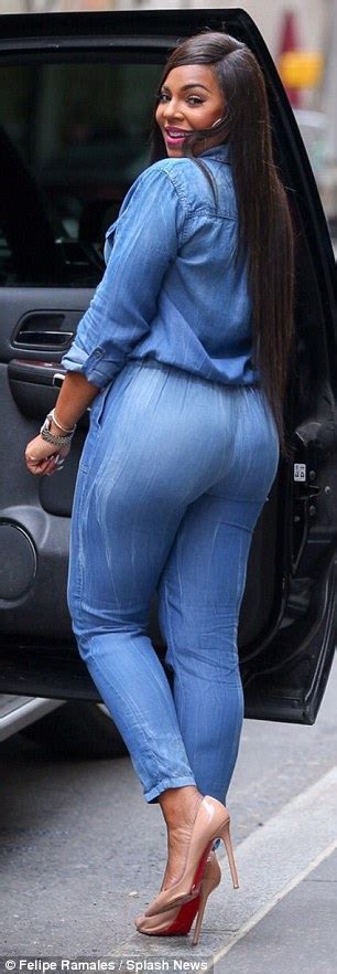 Ashanti Parades Her Curves In Clingy Denim Jumpsuit For Visit To The