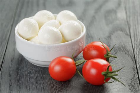 Small Mozzarella Balls In White Bowl With Plum Stock Image Image Of