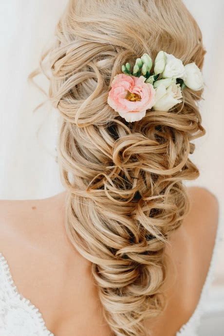 The essential products for achieving this look are texturizing powder for teasing to create a chunky braid with hold and a natural hold hairspray to finish. Bridal upstyles for long hair
