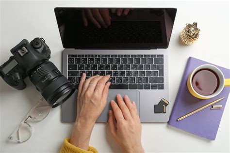 Female Photographer Using Laptop At Table Stock Image Image Of