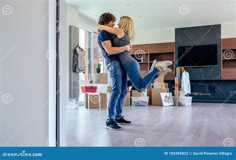 Couple Hugging In The Living Room Stock Photo Image Of Living Indoor
