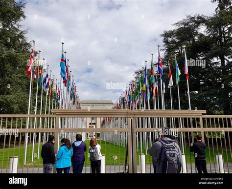 People Gather At The Gate To The United Nations Building And The
