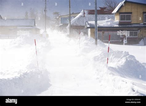 Snow Drifting Over Road Stock Photo Alamy