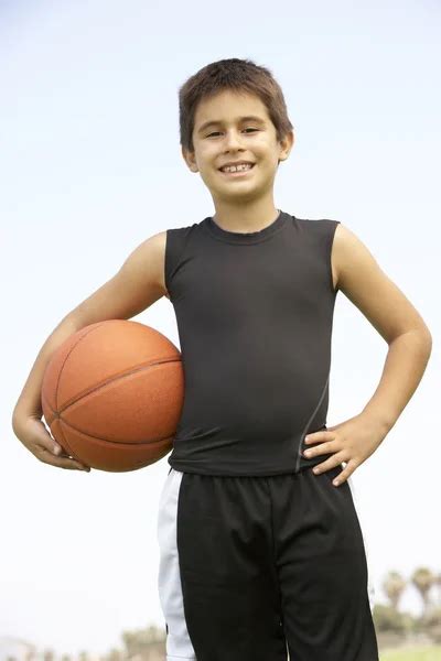 Young Boy Playing Basketball ⬇ Stock Photo Image By © Monkeybusiness