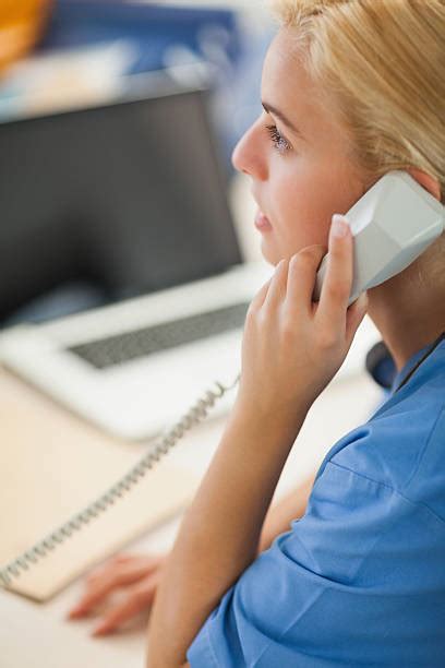 Nurse At Desk On Phone Stock Photos Pictures And Royalty Free Images