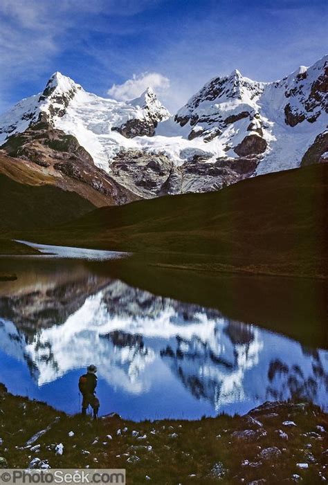 A Trekker Admires Glacier Covered Peaks Of The Cordillera Huayhuash