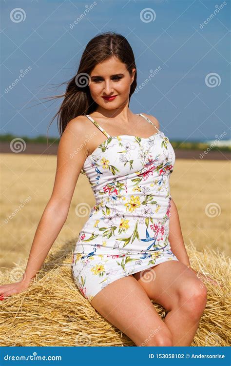 Young Brunette Model In White Dress In The Hayloft Stock Photo Image
