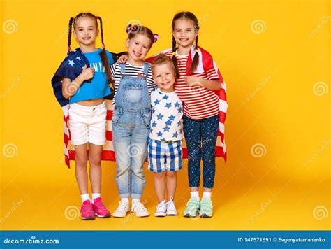Group Of Children With Flag Of United States Of America Usa On Yellow