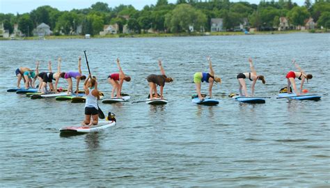 stand up paddle board yoga with perennial yoga madison maureen heblmaureen hebl sup yoga