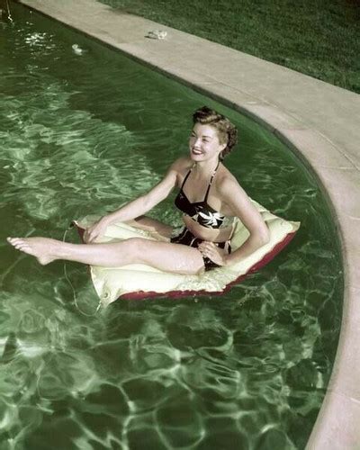 Barbara Stanwyck In Black Bikini On Flotation Device In Her Pool 8x10 Inch Photo The Movie Store