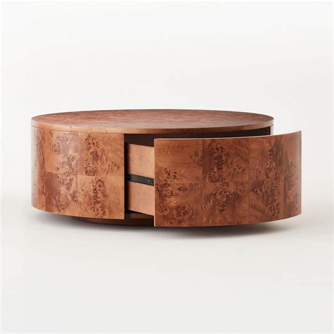 Every inch bears a black finish with a rustic wood grain effect. Purl Rotating Coffee Table