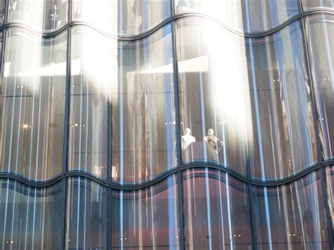 James Carpenter Design Associates Lets The Light Into Nordstrom With Gargantuan Double Curved