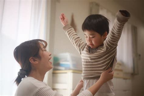 Mother Dressing Her Child Stock Image Image Of Mother 238943929