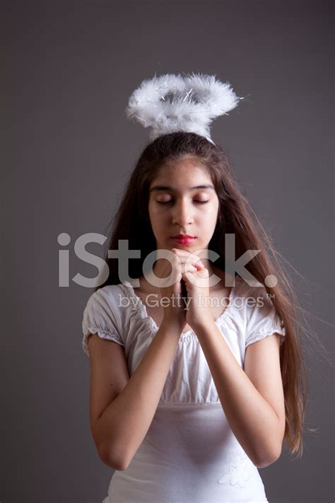 Praying Little Girl On Gray Background Stock Photos