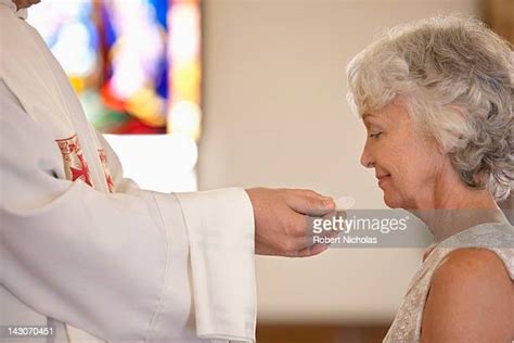 Catholic First Communion Ceremony Photos And Premium High Res Pictures