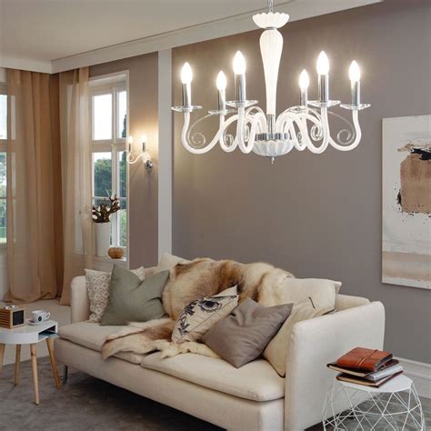 Hanging from the base are strands of crystals. The quirky white Meduno Ceiling Light provides a sleek ...