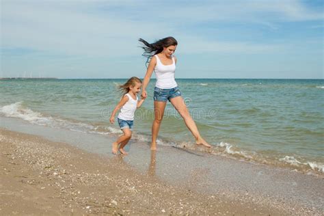 Mother And Her Daughter Having Fun On The Beach Stock Image Image Of Hold Little 47141765