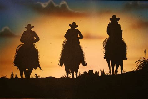 Download Western Cowboys Riding Sunset Wallpaper