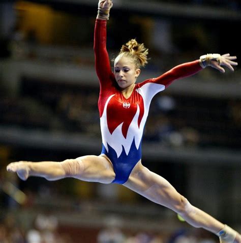 Gymnast Doing Splits On Balance Beam During Competition Womens
