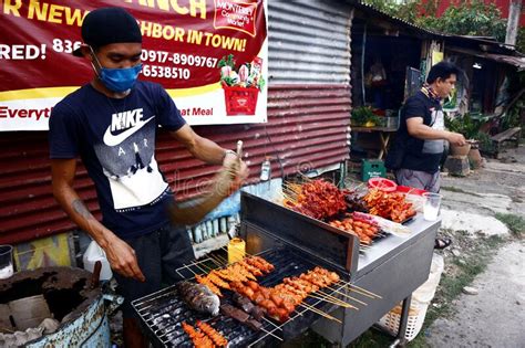 Street Vendor Sell Assorted Grilled Pork And Chicken Innards Barbecue At His Makeshift Food