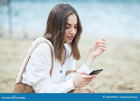 Girl Outdoors Texting On Her Mobile Phone Girl With Phone Portrait Of A Happy Woman Text Sms