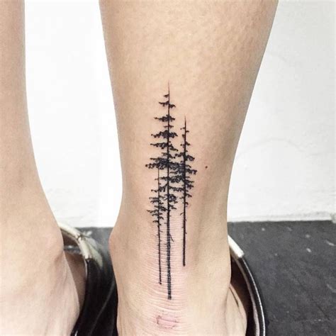 pine tree tattoo an ankle three black pine trees inked on the back of the ankle small tattoos