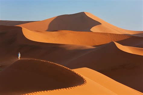 Man Climbing Sand Dunes Namib Desert Photograph By Peter Adams Fine