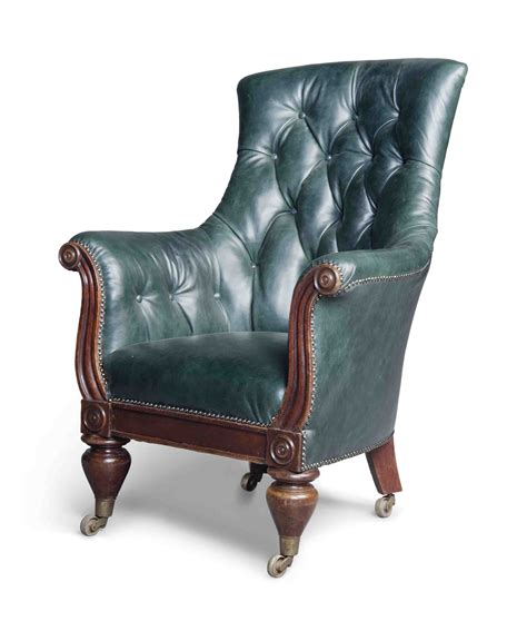 An Early Victorian Mahogany And Buttoned Leather Library Chair