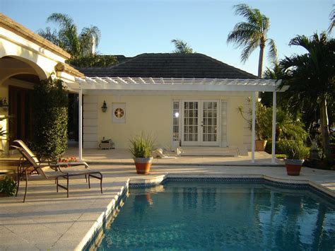 At nighttime the pergola and pool are illuminated with lights and a stunning gas fireplace. Pergola above French doors for pool deck | Patio addition ...