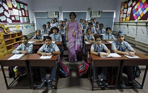 In New Delhi India Archana Shori Teaches Th Grade Students Inside Their Classroom At Rukmini