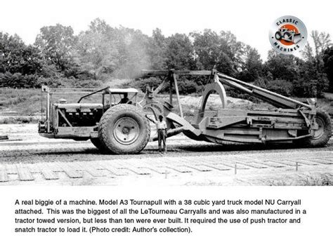 An Old Photo Of A Tractor Being Towed By A Tow Truck